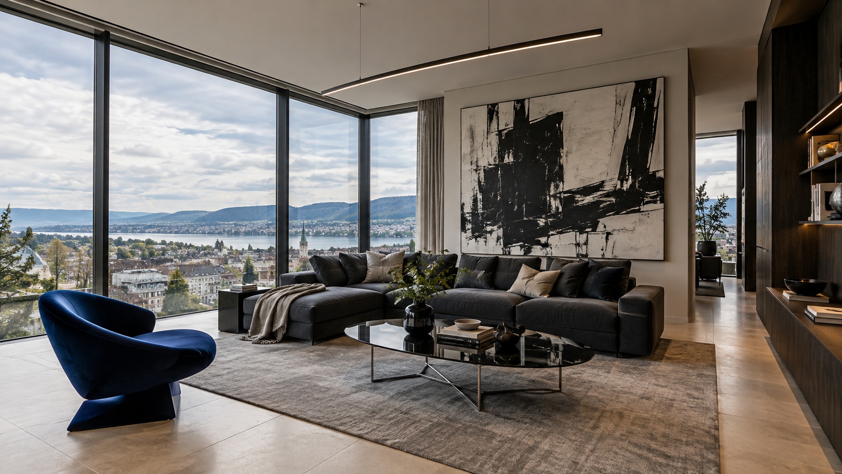 High-end contemporary living room with charcoal sectional, cobalt sculptural chair, glass table and oversized abstract wall art